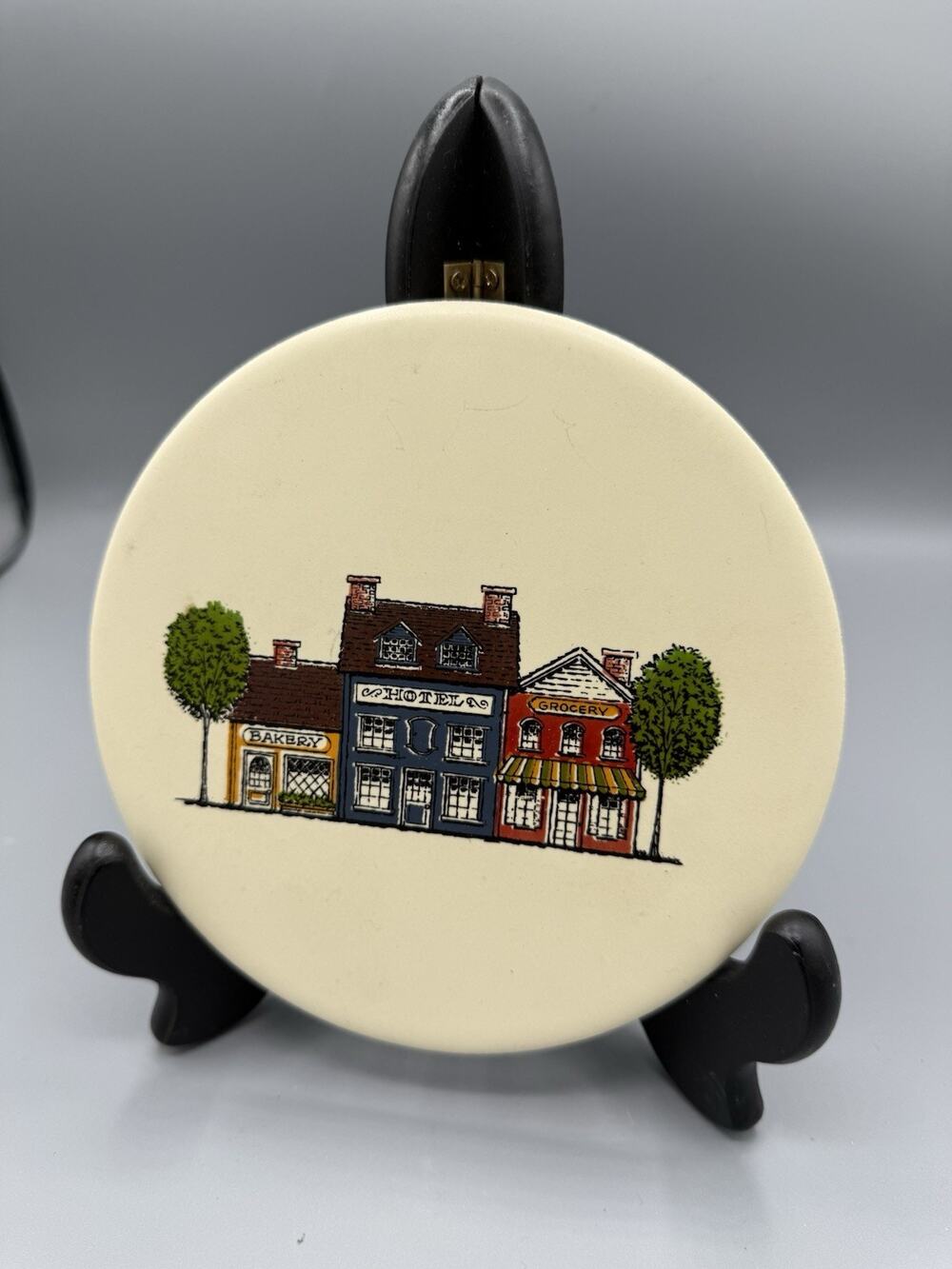 Mid-State Round Trivet or Plate Village Shops Bakery Hotel Grocery Stand